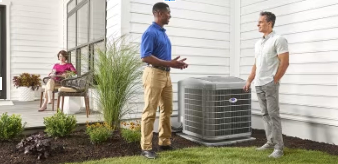 Two men talking about their heat pump in New Lenox, IL